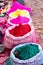 Bags of colored powdered paint sit waiting to be sold to Holi Festival celebrants