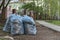 Bags of grass and garbage are piled up. cleaning residential yards