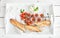 Baguette with branch of cherry-tomatoes, basil and