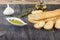 Baguette and olive oil dipping. Delicious Greek snack food and drink. Olive oil with herbs and garlic.