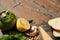 Baguette slices, pesto sauce in jar and fresh ingredients on stone surface