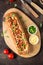 Baguette stuffed with bolognese ragout of minced beef, tomatoes and cheese. A delicious Italian lunch, tasty snacks, homemade