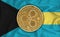 Bahamas flag, ripple gold coin on flag background. The concept of blockchain, bitcoin, currency decentralization in the country.