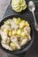 Bahamian chicken souse is a poultry dish made with chicken wings, onions, potatoes, celery, lime juice, allspice closeup on the