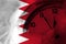 Bahrain, Bahraini flag with clock close to midnight in the background. Happy New Year concept