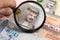 Bahraini dinar in a magnifying glass