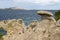 Baia Sardinia Coastal View with Naturally Sculpted Rocks and Distant Island of Isola Caprera : Baia Sardinia, Gallura, Sardinia, I