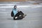 Baikal lake, Russia, March, 01, 2017. Young woman riding on a sled sledges MS icy shores of lake Baikal