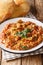 Baingan bharta mashed eggplant is a dish from the Indian that originated in the Punjab region closeup on the plate. Vertical