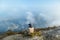 Bajawa - a girl sitting on the top of the volcano, admiring the view