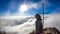 Bajawa - Girl standing on top of a volcano, surrounded by clouds