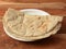 Bajra Roti or Bajra bhakri is a traditional Indian flat bread made with bajra or black pearl millet flour, served over a rustic