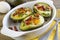 Baked avocados and eggs with bacon and chives