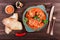 Baked beef with vegetables served with fork, bread, spices on wooden background. Hot Meat Dishes. Caucasian food