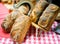 Baked Bread Loaves Displayed on Tablecloth