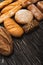 Baked bread loaves on wooden black