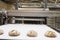 Baked breads on production line