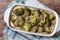 Baked broccoli with spices and herbs horizontal top view