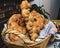 Baked buns, colaci or cakes in straw baskets and towel with traditional Romanian and Ukrainian motifs. Bread in form of snails or