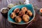 Baked champignons mushrooms with butter, spices on wooden background. Healthy food concept.