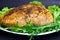 baked chicken breast with lettuce leavesbaked chicken breast with green lettuce and arugula