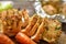 Baked chicken breast. Wooden background. Chicken breast, baked carrots, knife, on a wooden board. Closeup.