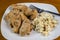 Baked chicken wigs served with macaroni salad