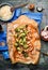 Baked chopped Chicken with Broccoli , soy sauce and rice on rustic background,