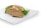 Baked chopped pork liver pate on white square dish closeup