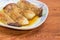 Baked Eringi mushrooms on dish closeup on the rustic table