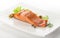 Baked fillet of trout with green letuce and basil