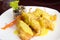 Baked fish fillets with cheese sauce