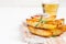 Baked fried potatoes with rosemary and tomato sauce on a white background, selective focus