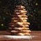 Baked gingerbread christmas tree on wooden background