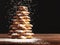 Baked gingerbread christmas tree on wooden background