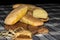 Baked golden bread loaf on a wooden chopping board