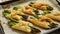 Baked green asparagus in puff pastry sprinkled with sesame seeds. Placed on a white baking paper