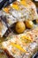 Baked haddock with lemon slices and small potatoes