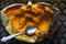 Baked half of pumpkin with spoon in it on the baking tray