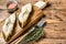 Baked halibut fish steak. wooden background. Top view. Copy space