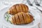 baked Hasselback potato in a plate, close up