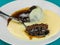 Baked Homemade Sticky Toffee Pudding Dessert Served With Hot Custard