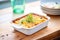 baked lasagna with crispy edges in a ceramic dish