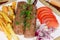 Baked lula kebab with French fries on dish close-up