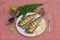 Baked mackerel or scomber fish served on table