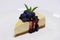 Baked new york style vanilla cheesecake with berries in a white plate