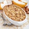 Baked oatmeal with nuts, almond milk, honey, spices and asian pear, square