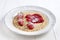 Baked pancake with strawberries and jam