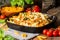 Baked pasta with broccoli, cauliflower, cheese and bechamel sauce
