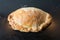 Baked pasty hot out of the oven on a baking tray